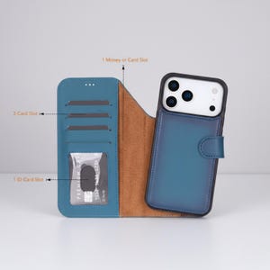 May include: Blue leather phone case with a wallet design. The case has a magnetic closure and features slots for cards and an ID. The phone case is shown open, revealing a brown interior and a phone secured in a black frame.