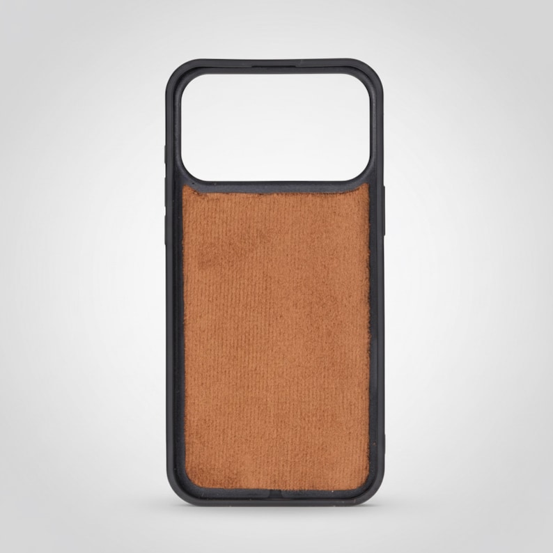 May include: A black phone case with a brown, textured back. The case has a rectangular shape with rounded corners and a cutout for the camera. The back of the case has a soft, suede-like appearance.