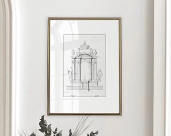May include: A framed architectural drawing in a gold-colored frame hangs on a white wall. Below the frame, a white pitcher holds greenery and dried flowers. The image has a neutral, vintage aesthetic.