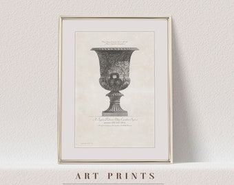 May include: A black and white antique illustration of a large, ornate vase with a detailed design. The vase is depicted in a framed print with a gold frame. The text below the vase reads "A. Signora Elisabetta Villa Cavaliere System.  in Venezia dall' anno 1763."