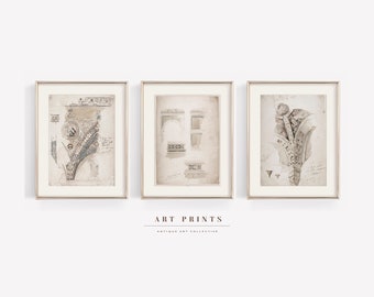 May include: Three framed art prints featuring antique architectural sketches. The prints have a neutral color palette with gold frames. The prints are labeled "Art Prints" and "Antique Art Collective". The sketches include detailed drawings of architectural elements.