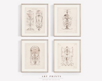 May include: Set of four antique-style prints featuring intricate black and white illustrations of ornate designs. The prints are framed in silver frames and have a cream background.