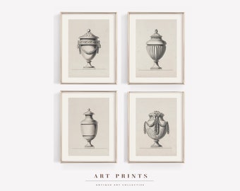May include: Set of four black and white prints of antique urns with ornate details. The prints are framed in gold and displayed on a white background.  ART PRINTS ANTIQUE ART COLLECTIVE.