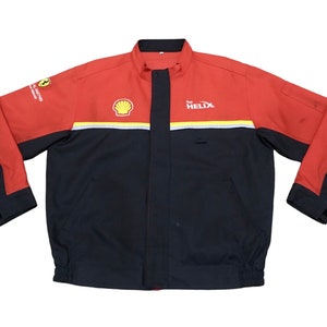 May include: A black and red jacket with a Shell logo and the text "HELIX" on the front. The jacket also has a Ferrari logo on the left sleeve.