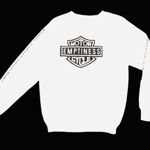 May include: White long-sleeve sweatshirt with a black and white graphic of a motorcycle logo that says "Motor Emptiness Cycle".