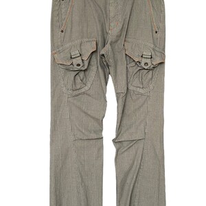 May include: Gray and white plaid cargo pants with orange stitching and large pockets on the sides.