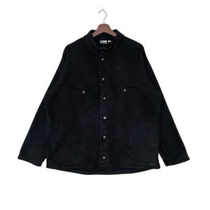 May include: A black fleece jacket with a button-up front and two large pockets. The jacket has a stand-up collar and long sleeves.