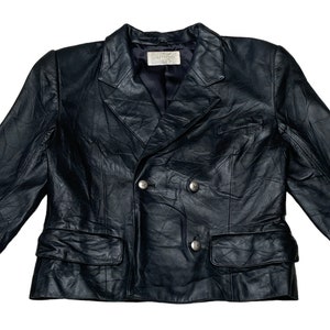 May include: A black leather double-breasted blazer with a  "Couturier" label.