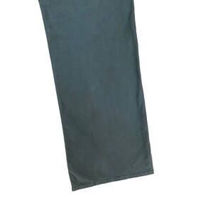 May include: A pair of dark blue trousers with a straight leg.
