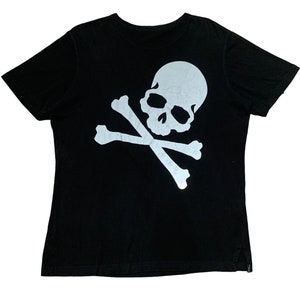 May include: Black t-shirt with a white skull and crossbones graphic.