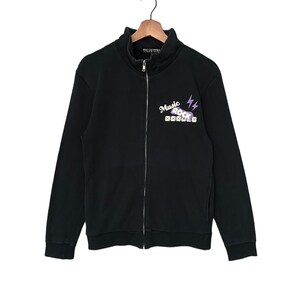 May include: Black zip-up sweatshirt with a purple and white graphic that says "Music Rock" with lightning bolts.