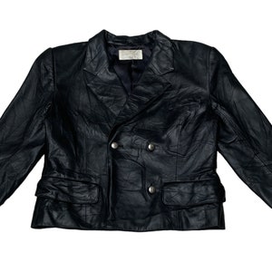 May include: A black leather blazer with a double-breasted closure and two front pockets. The blazer has a textured look and features silver buttons.