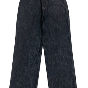 May include: A pair of dark wash denim jeans with a straight leg fit.