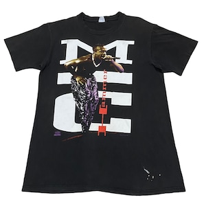 May include: Black t-shirt with a white graphic of MC Hammer performing on stage. The graphic includes the text "Hammer" in red letters.