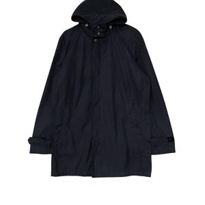 May include: A black hooded jacket with a zipper closure and buttoned flap. The jacket has a long length and a relaxed fit.