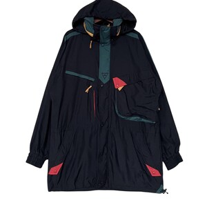 May include: A black hooded jacket with green, red, and yellow accents. The jacket has a zipper closure and multiple pockets.