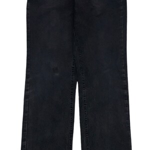 May include: Black denim jeans with a straight leg fit.