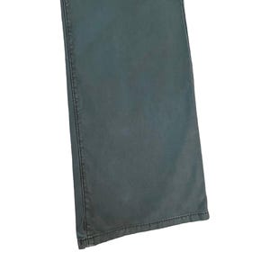 May include: A pair of dark green denim jeans with a straight leg fit.