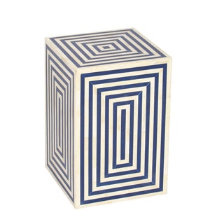 May include: A square stool with a geometric pattern in white and blue. The stool features a striped design in blue and white.