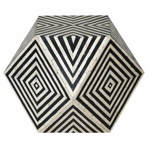 May include: Black and white geometric patterned hexagonal side table. The table is made of bone inlay and has a unique design.