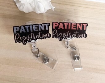 May include: Two black and white retractable badge holders with the text "PATIENT Registration" in pink and silver glitter.
