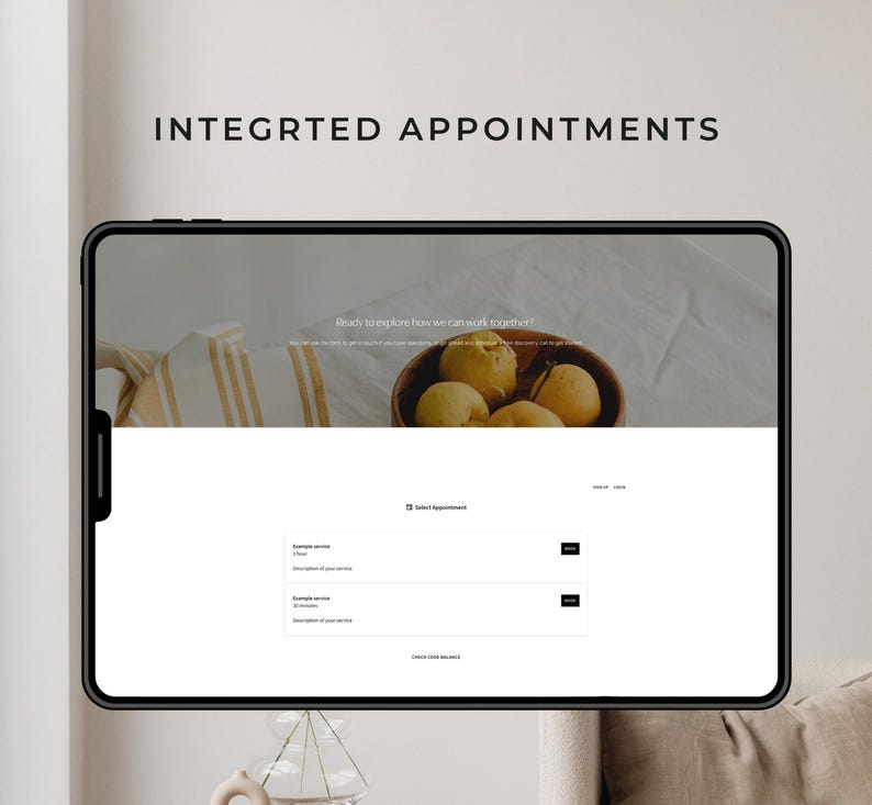 May include: A digital tablet displays a website interface with the text "INTEGRTED APPOINTMENTS." The screen shows a wooden bowl of fruit and appointment options. The website's design is clean with a neutral color palette.