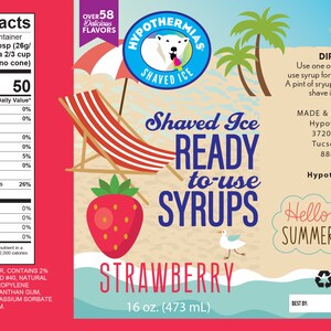 May include: A red and white label with a strawberry graphic and the text "Shaved Ice Ready to-use Syrups Strawberry 16 oz. (473 mL)". The label is on a bottle of strawberry flavored syrup for shaved ice.
