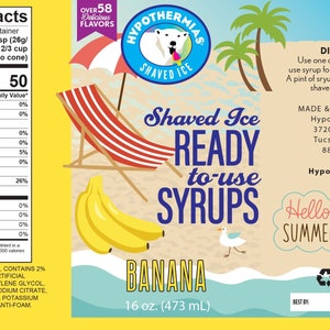 May include: A yellow label with a cartoon banana and a beach scene. The label reads "Hypothermias Shaved Ice Ready to Use Syrups Banana 16 oz (473 mL)".