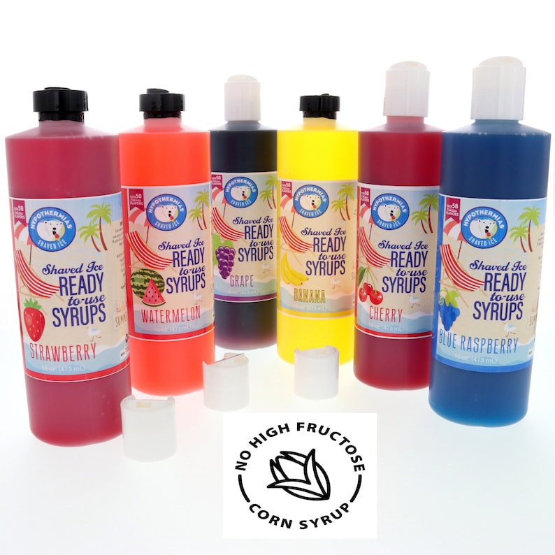 May include: Six bottles of shaved ice syrup in various flavors: strawberry, watermelon, grape, banana, cherry, and blue raspberry. The bottles are labeled with the flavor and the words "Shaved Ice Ready to Use Syrups". The bottles are arranged in a row on a white surface. A sticker with the text "No High Fructose Corn Syrup" is in the foreground.