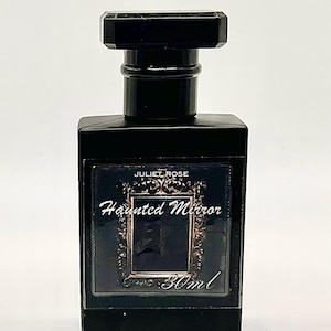 May include: A black rectangular perfume bottle with a matching cap. The label reads "JULIET ROSE Haunted Mirror" with a decorative frame and the volume is 30ml.