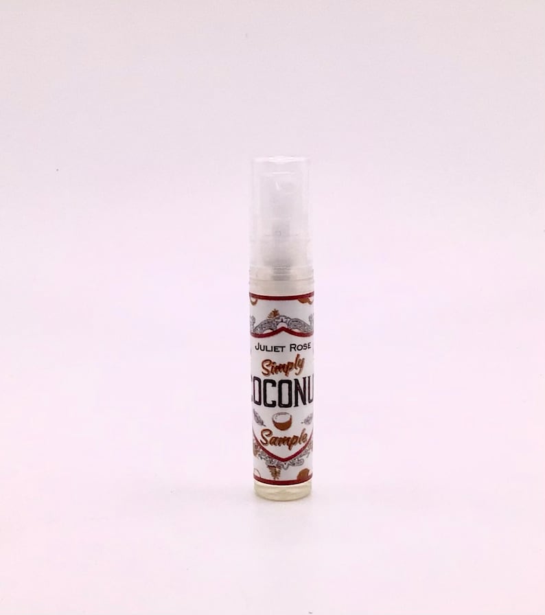 May include: A small clear bottle with a white label that says "Juliet Rose Simply Coconut Sample".