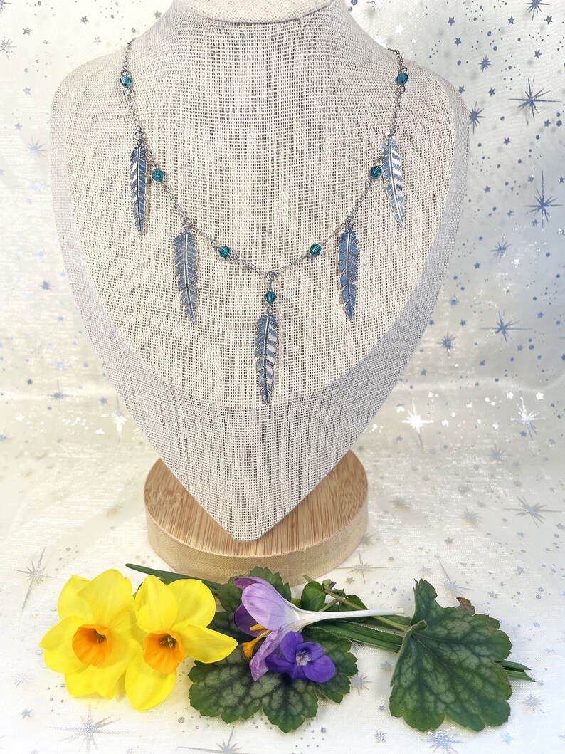 ASSIA set sold separately: silver earrings and necklace with feather pendants and blue glass beads Collier