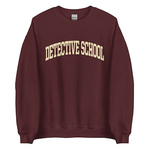 DETECTIVE SCHOOL College Sweatshirt