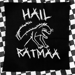 May include: Black patch with white text and a graphic of a creature. The text reads "HAIL RATMAA".