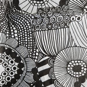 May include: Black and white abstract pattern with a repeating design of circles, dots, and lines. The pattern is reminiscent of a floral design.