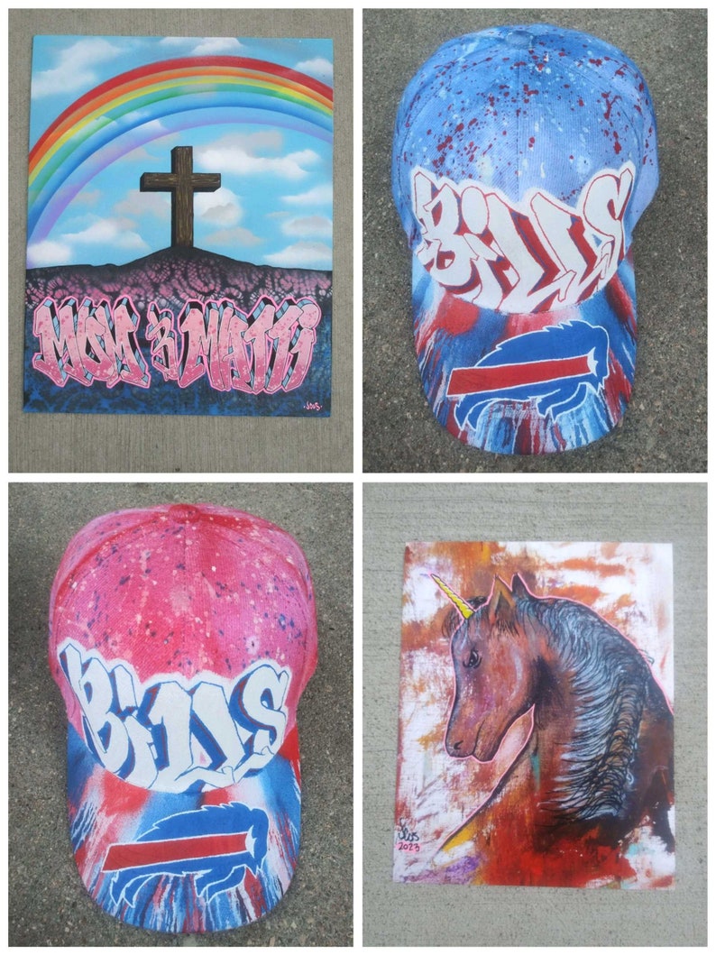 May include: Four different pieces of art, including a painting of a rainbow with a cross, a painting of a unicorn, and two baseball caps with the word "Bills" painted on them.