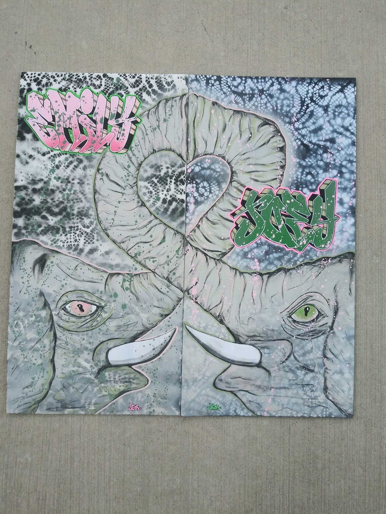 May include: Two gray elephant heads with pink and green accents, facing each other, with their trunks intertwined in a heart shape. The background is a white and gray abstract pattern with the words "Sorry" and "Smiley" written in pink and green.