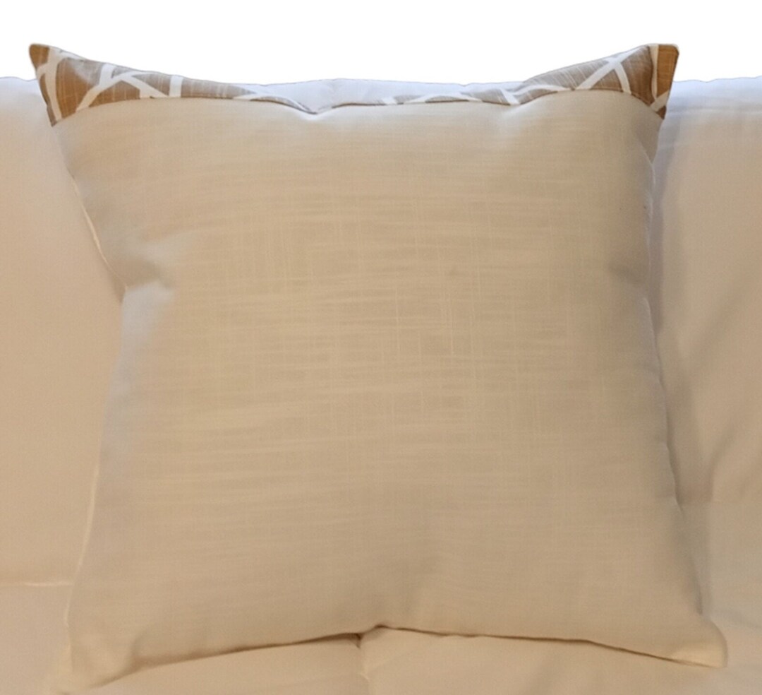A Pair of White Cotton Decorative Pillows With Spicy Tan Geometric