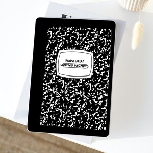 May include: A black and white digital tablet displaying a black and white image of a notebook with the text "Kinda Weird Writing Prompts".