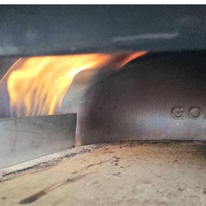 Durable and heat-resistant flame guard for optimal pizza cooking