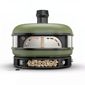 May include: Olive green outdoor pizza oven with the brand name "GOZNEY" visible. The oven has a black chimney and a front opening with a metal interior. The base features a compartment for wood and control knobs. The oven is designed for outdoor cooking.
