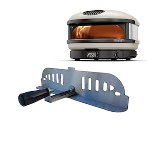 May include: A cream-colored Gozney pizza oven with a black base and digital display showing 950 degrees. Below, a metal pizza peel with a black handle.