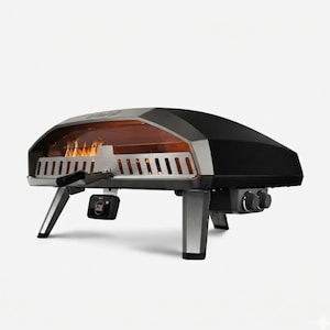 May include: A black and silver outdoor pizza oven with a domed top and stainless steel accents. The oven has a glass front, showing flames inside. It has a digital control panel and sits on four metal legs.