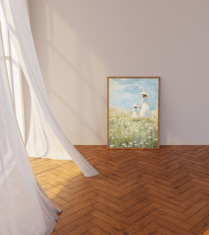Peut inclure: Une peinture encadr&eacute;e repr&eacute;sentant deux personnages en robes blanches marchant dans un champ de fleurs blanches. Le ciel est bleu avec des nuages blancs. La peinture est dans un cadre en bois.