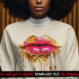 May include: A white sweatshirt with a gold and pink dripping lips design. The lips are outlined in gold and have a pink center. The design is dripping down the front of the sweatshirt.