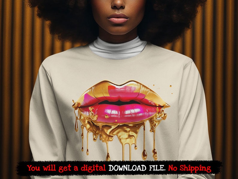 May include: A white sweatshirt with a gold and pink dripping lips design. The lips are outlined in gold and have a pink center. The design is dripping down the front of the sweatshirt.