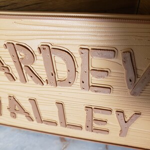 May include: A wooden planter box with the words "Garden Valley" embossed on the front.