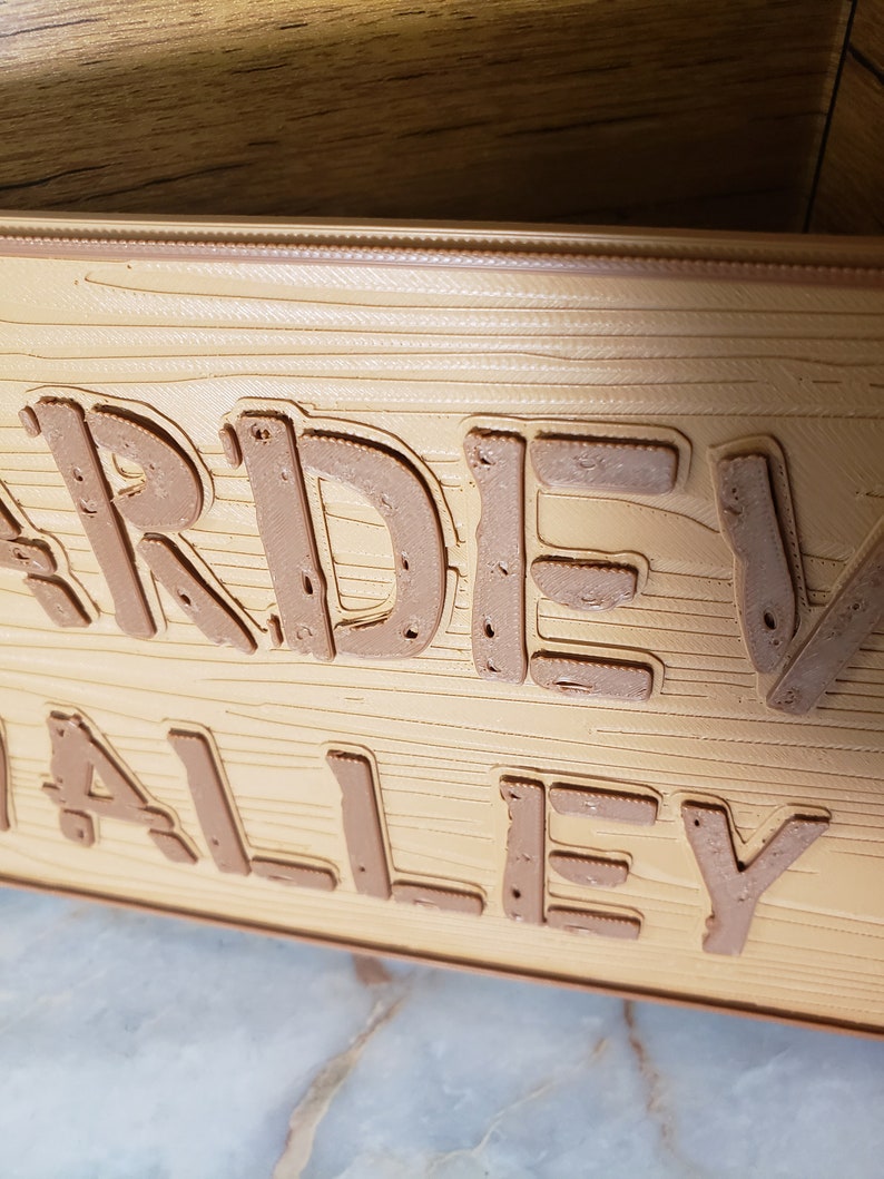 May include: A wooden planter box with the words "Garden Valley" embossed on the front.