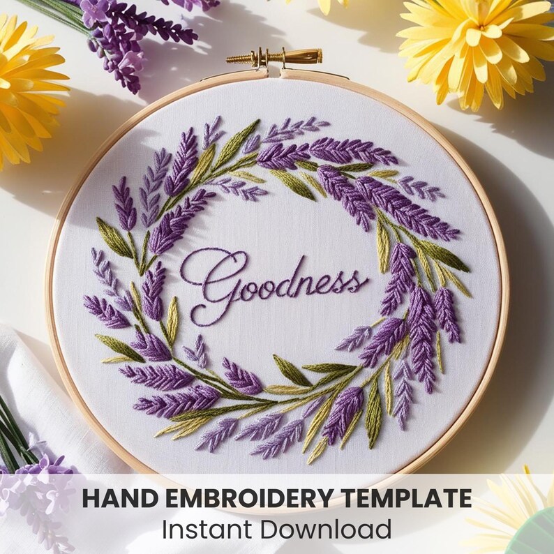 May include: A hand embroidery template featuring a wreath of lavender flowers with the word "Goodness" in the centre. The template is in a wooden embroidery hoop.
