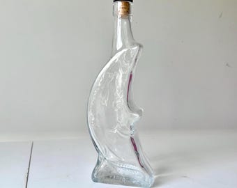 Botella de licor celestial de cristal con cara de luna italiana